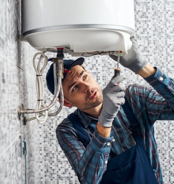 A plumber doing the bottom of the sink